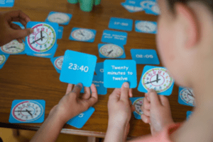 tell the time card games
